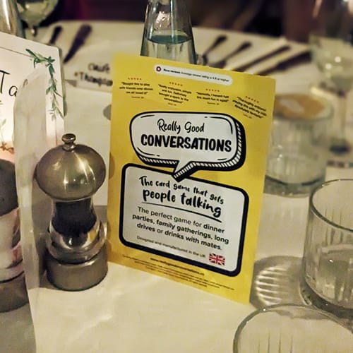 RGC display card at a dinner table